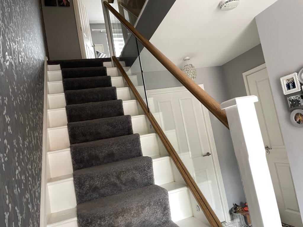 10mm clear toughened glass panel staircase with oak slotted handrail and base rail